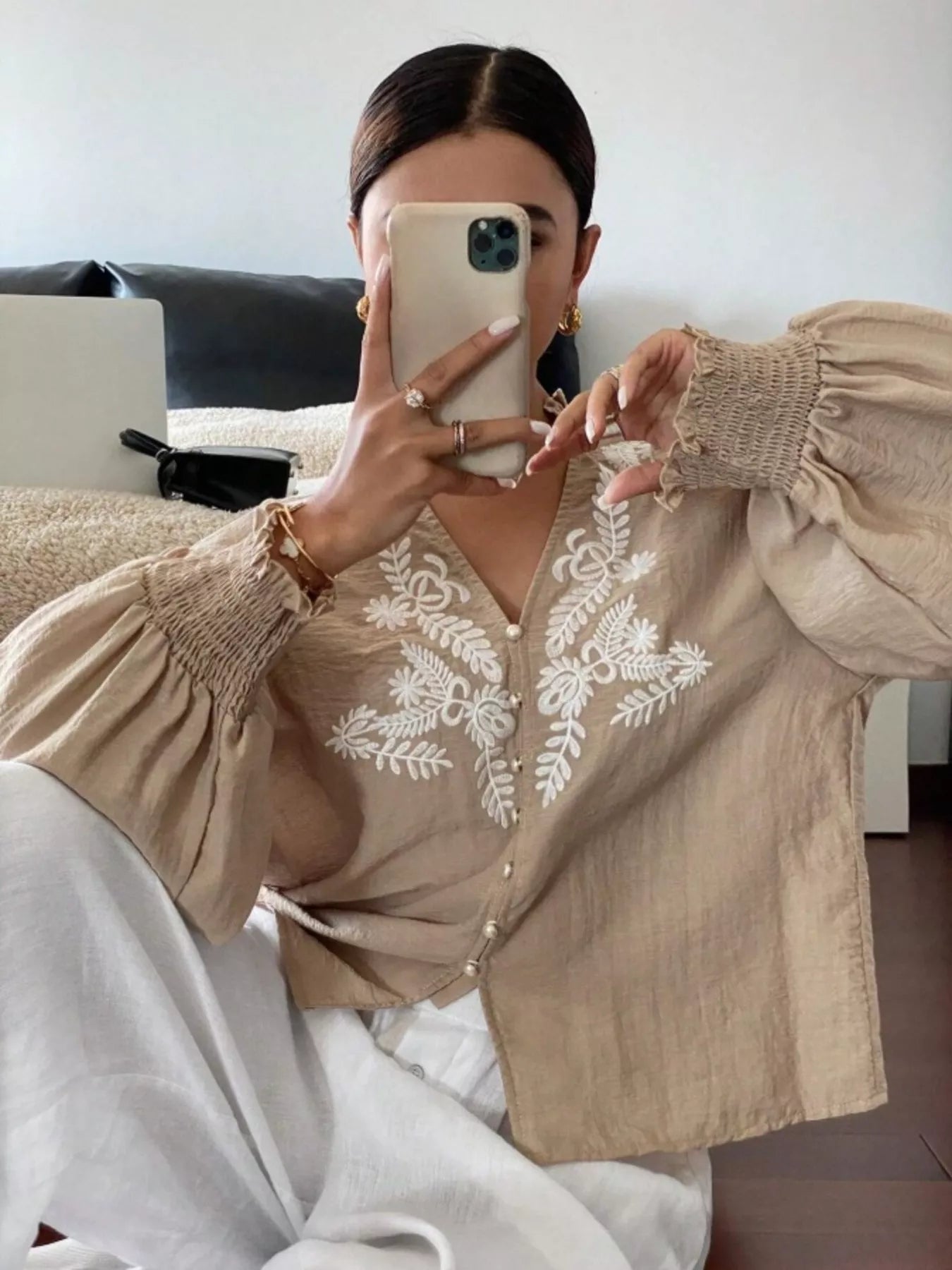 A Woman Wearing Apricot embroidered blouserelaxed fit and stylish everyday wear