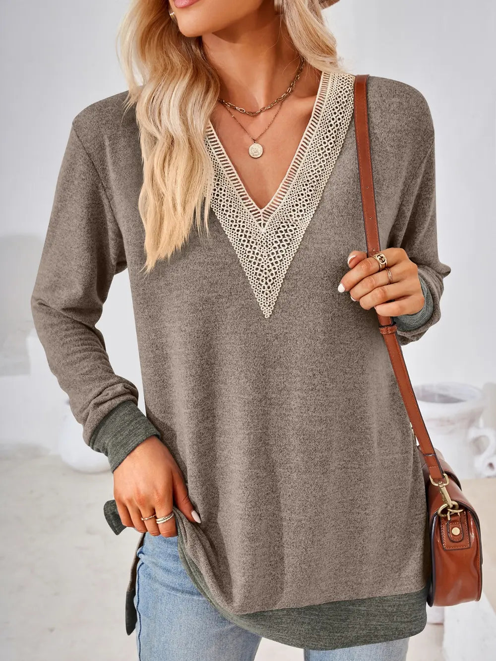 Army green long sleeve top with crochet detailing and side slit hem for everyday wear
