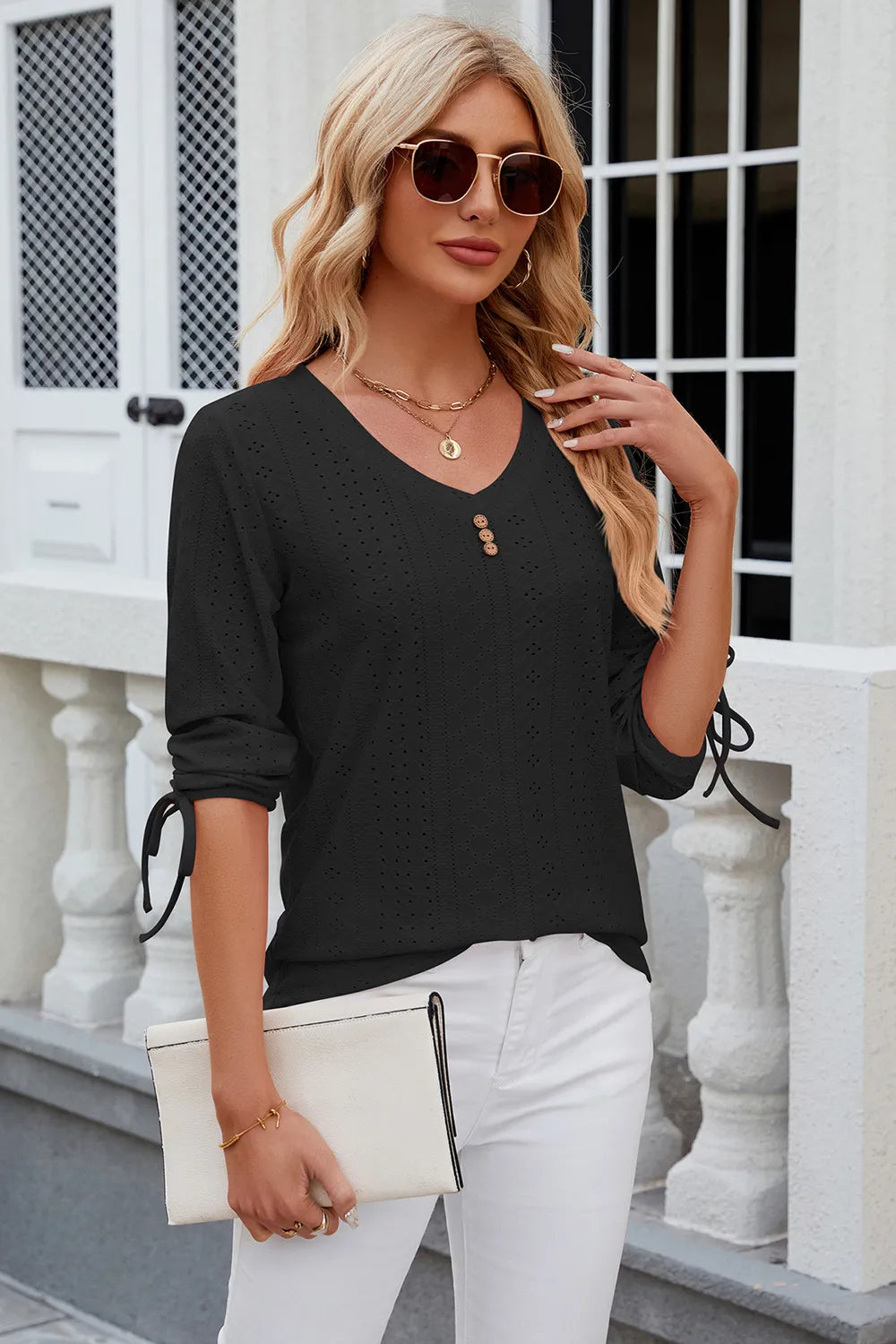 Black eyelet top with V neckline, half sleeves and versatile everyday styling