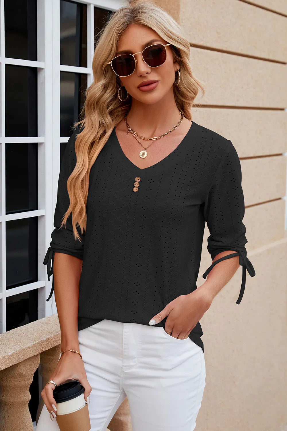 Black eyelet drawstring V neck top with half sleeves and elegant embroidered detailing