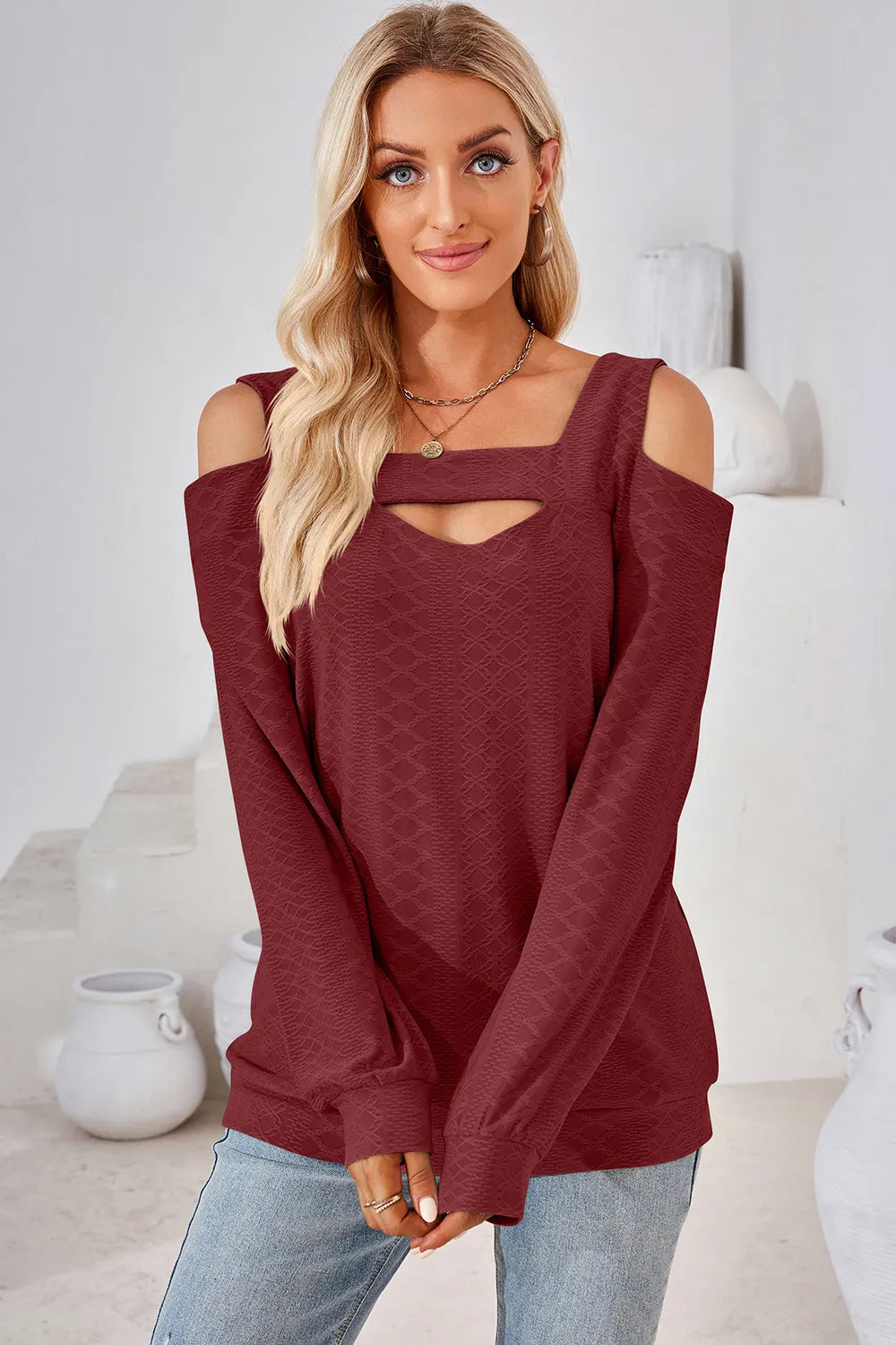 Burgundy long sleeve cold shoulder top featuring square neckline and shoulder cut out detail