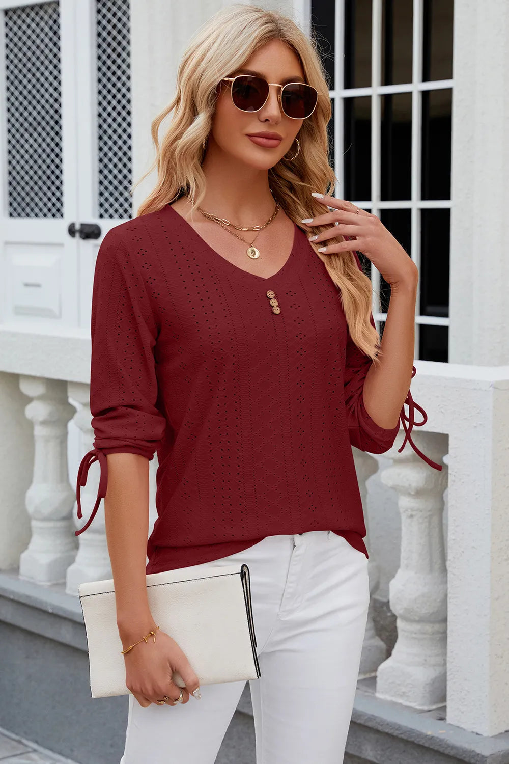 Burgundy half sleeve blouse featuring eyelet embroidery and adjustable drawstring front
