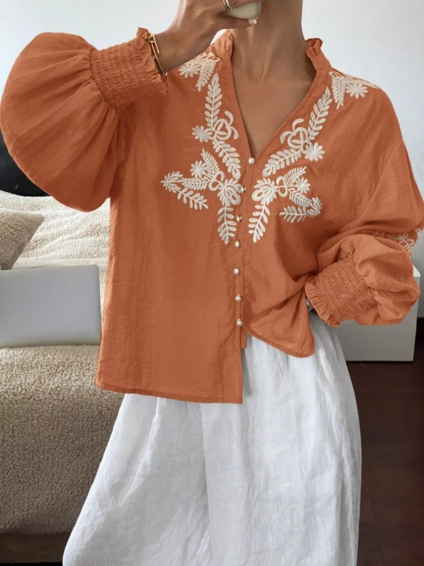Burgundy embroidered blouse three quarter angle versatile women's wardrobe essential