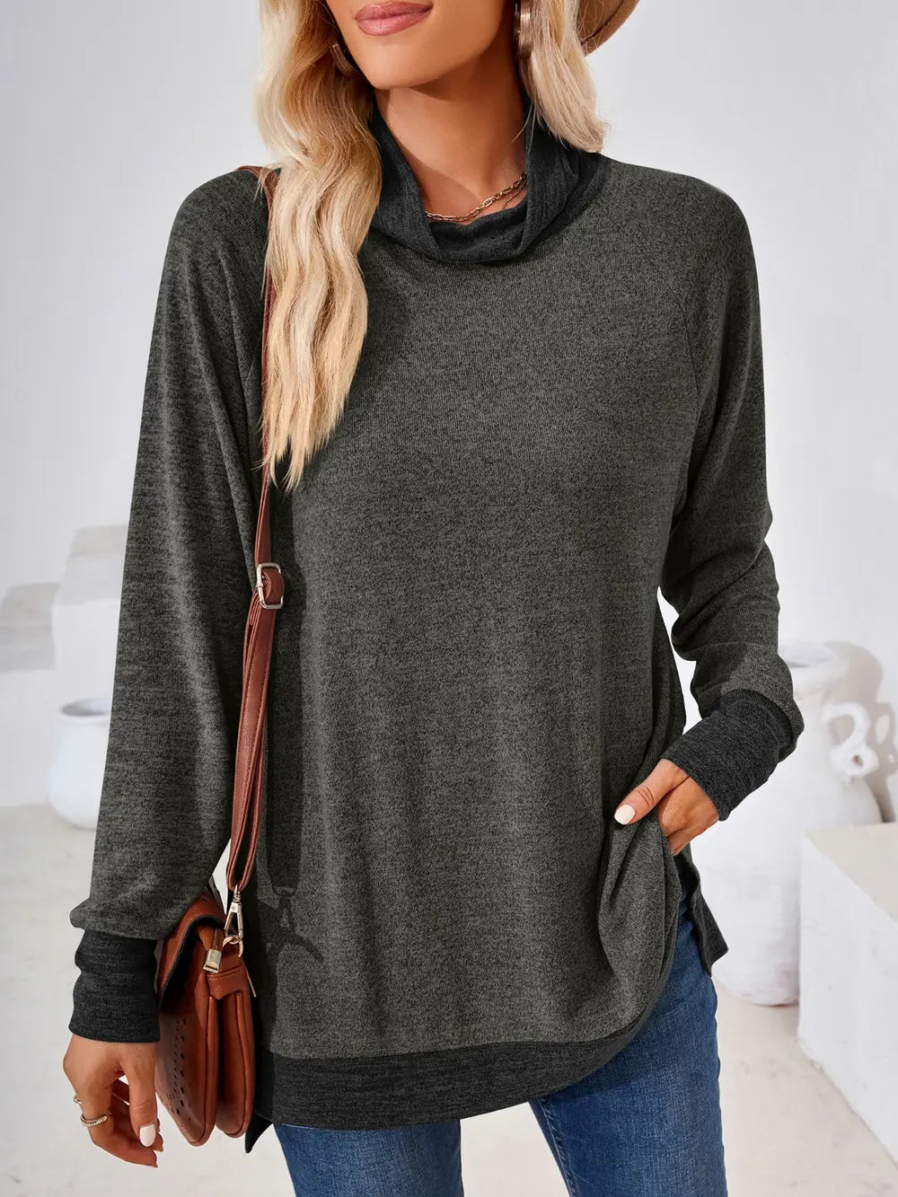 Charcoal long sleeve mock neck top featuring contrast detailing and versatile styling options