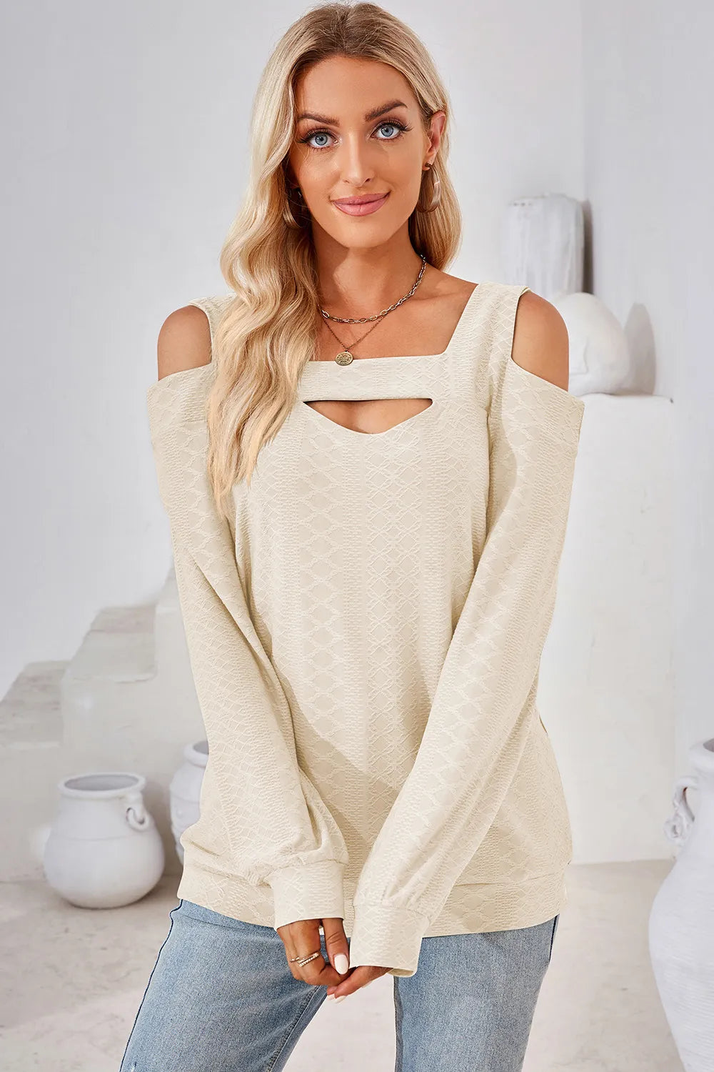 Cream cut out square neck cold shoulder top with long sleeves and elegant casual styling