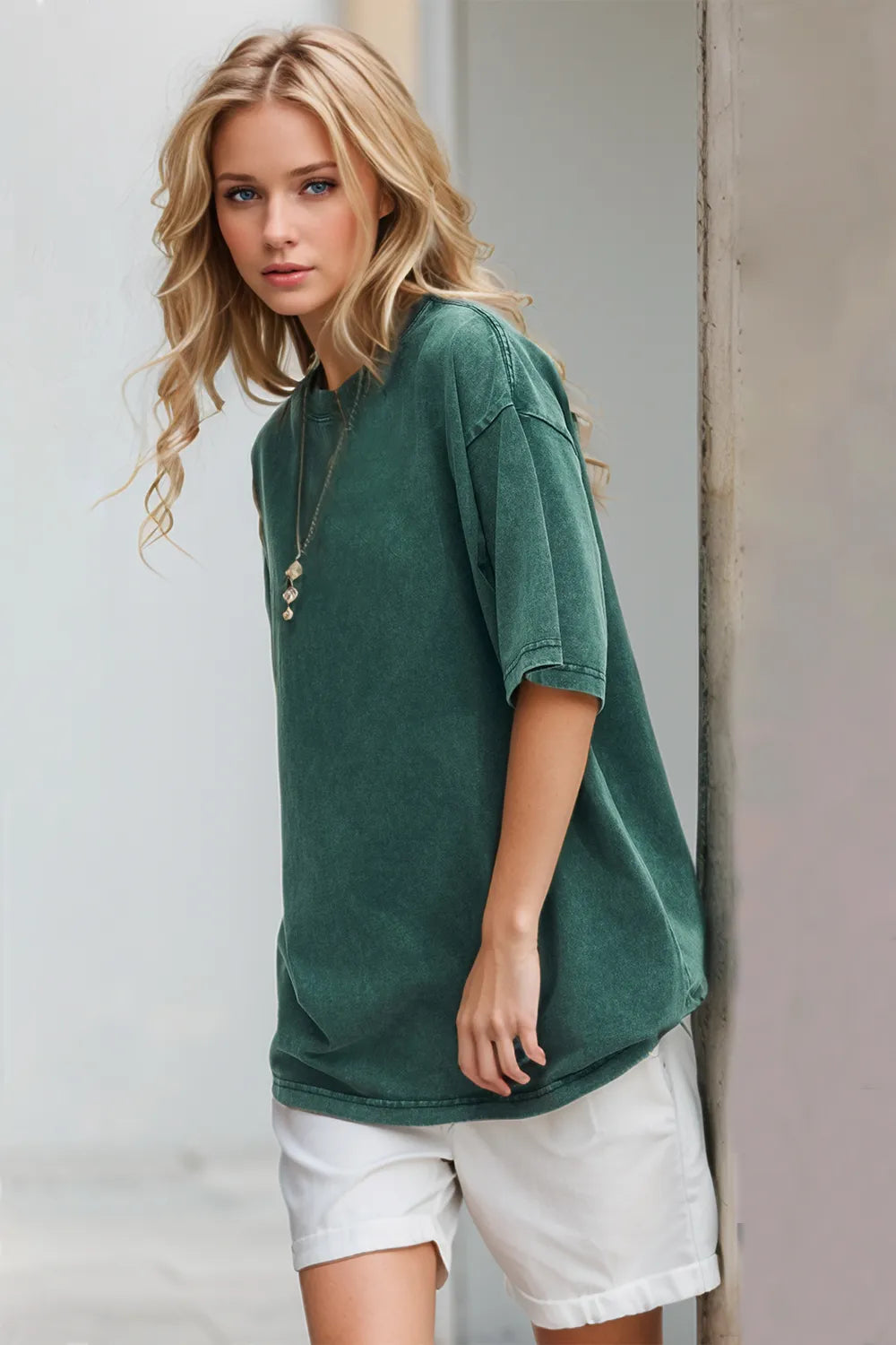 Deep teal cotton round neck half sleeve t-shirt angled view comfortable women's wardrobe essential