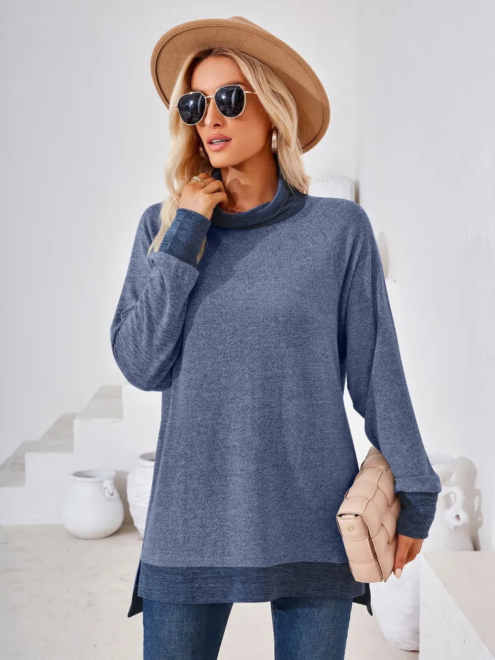 Dusty blue mock neck top with long sleeves and contrast accents for everyday wear