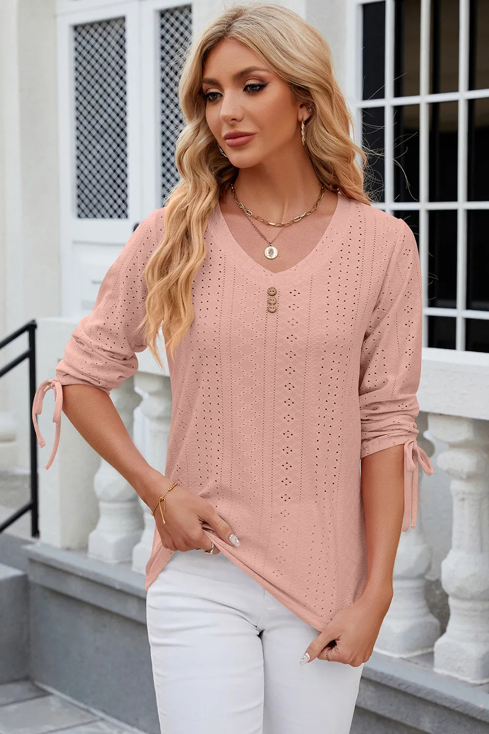 Dusty pink half sleeve blouse featuring eyelet embroidery and adjustable drawstring front