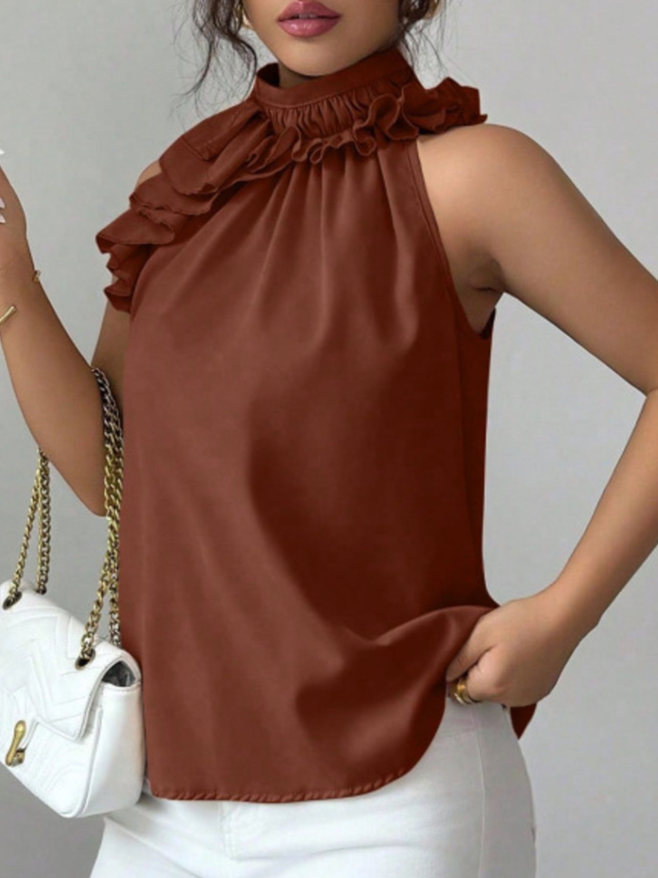 Elegant brown sleeveless top featuring ruffle high neck design for work and evening wear
