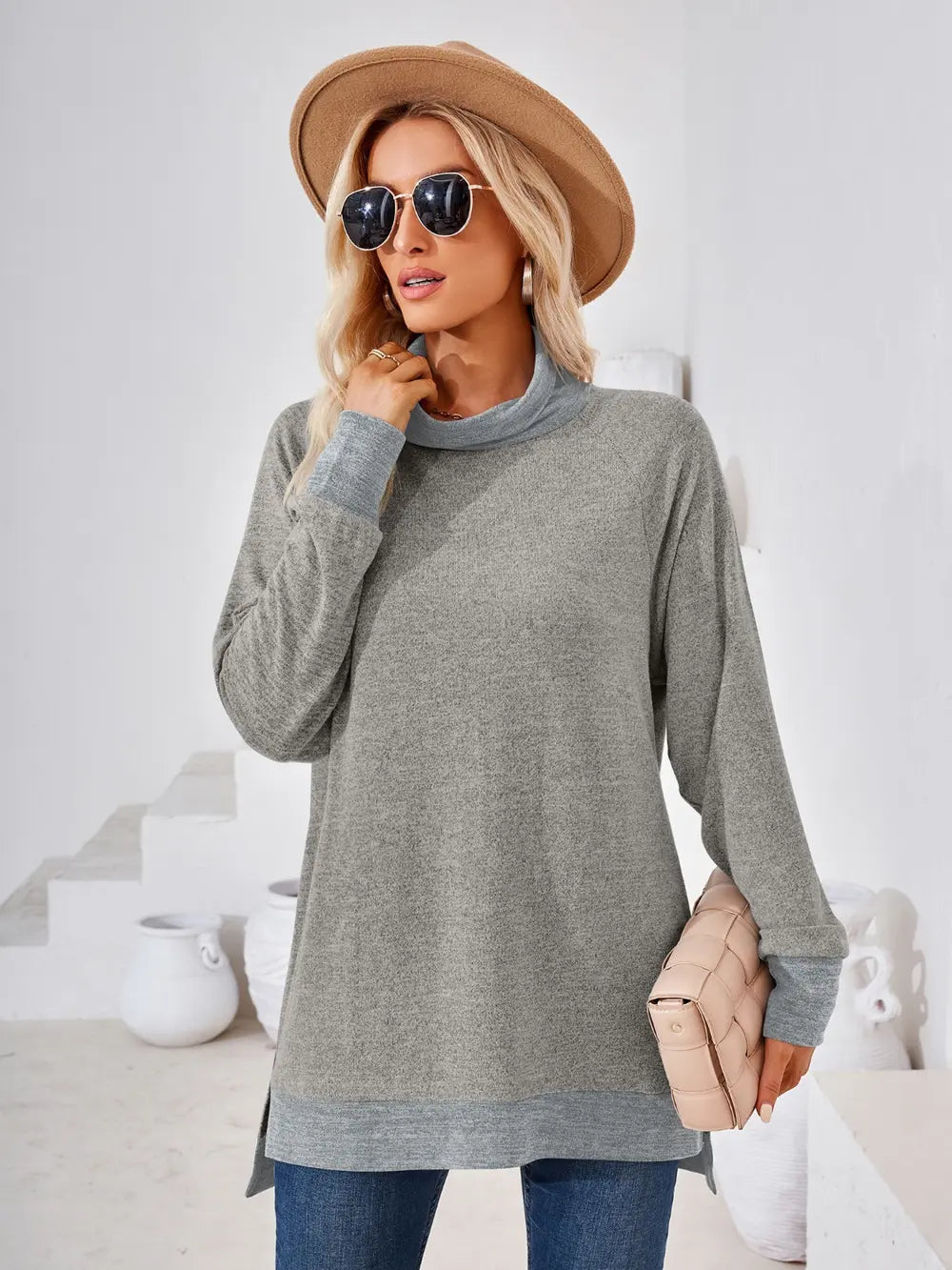 Light gray long sleeve mock neck top with contrast accents and soft stretch fabric