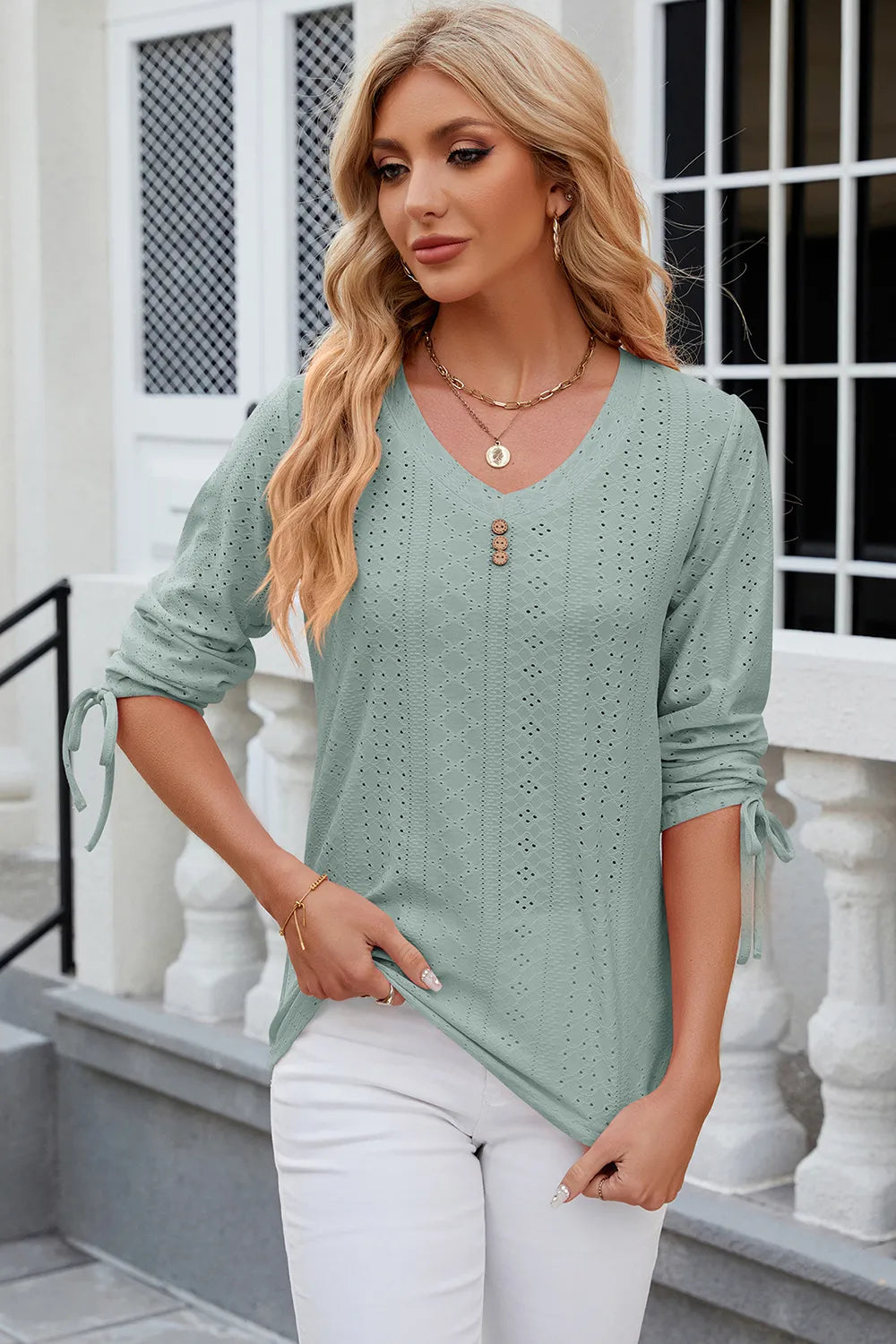 Light green eyelet drawstring V neck top with half sleeves and delicate embroidered pattern