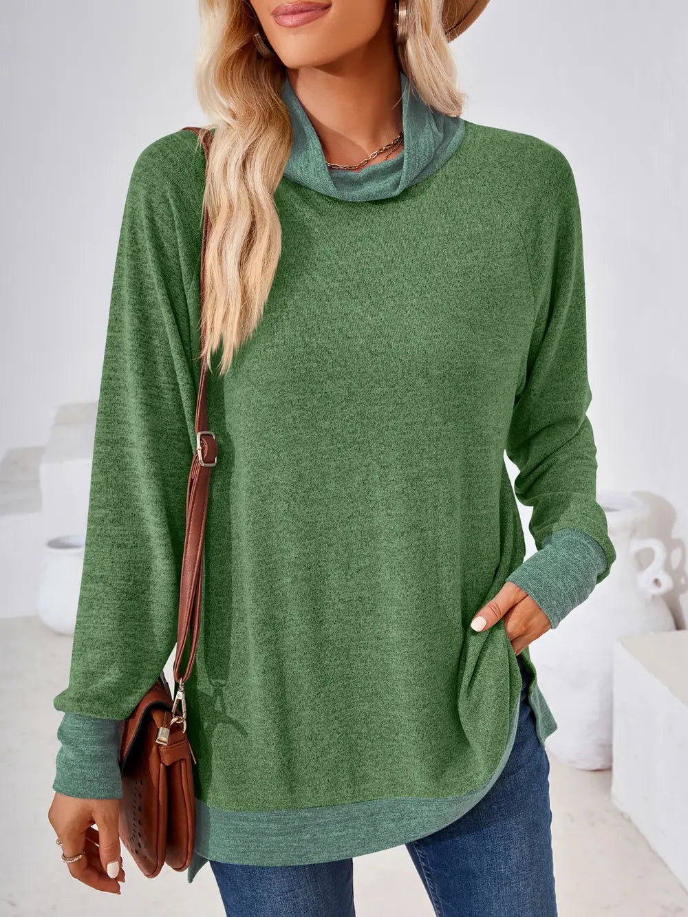 Moss long sleeve top featuring mock neck design and contrast detailing for everyday wear