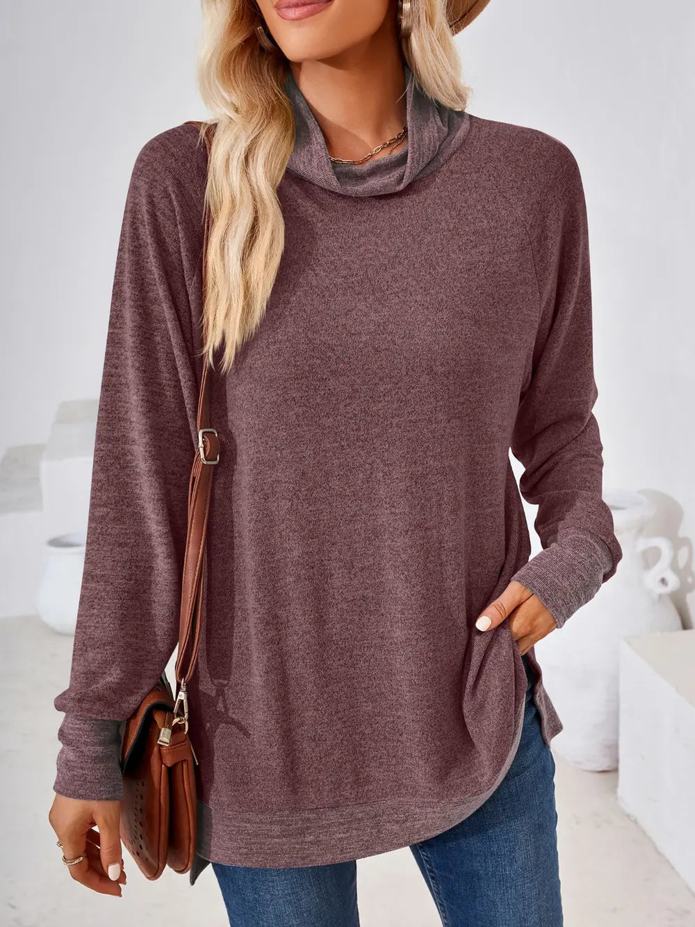 Plum long sleeve top featuring contrast neckline and comfortable stretch fabric