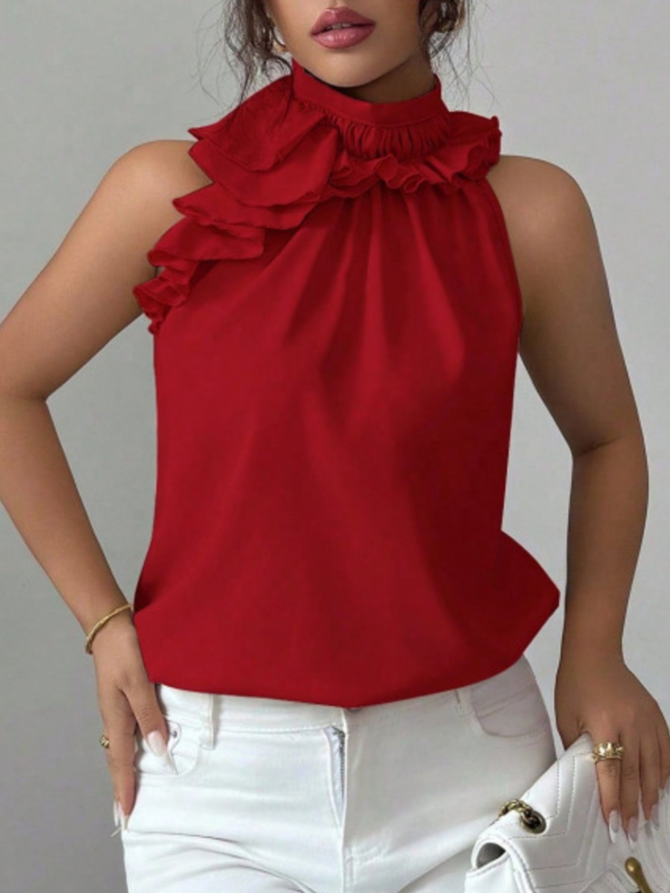 Red high neck ruffle blouse with sleeveless cut and button front detail for everyday elegance