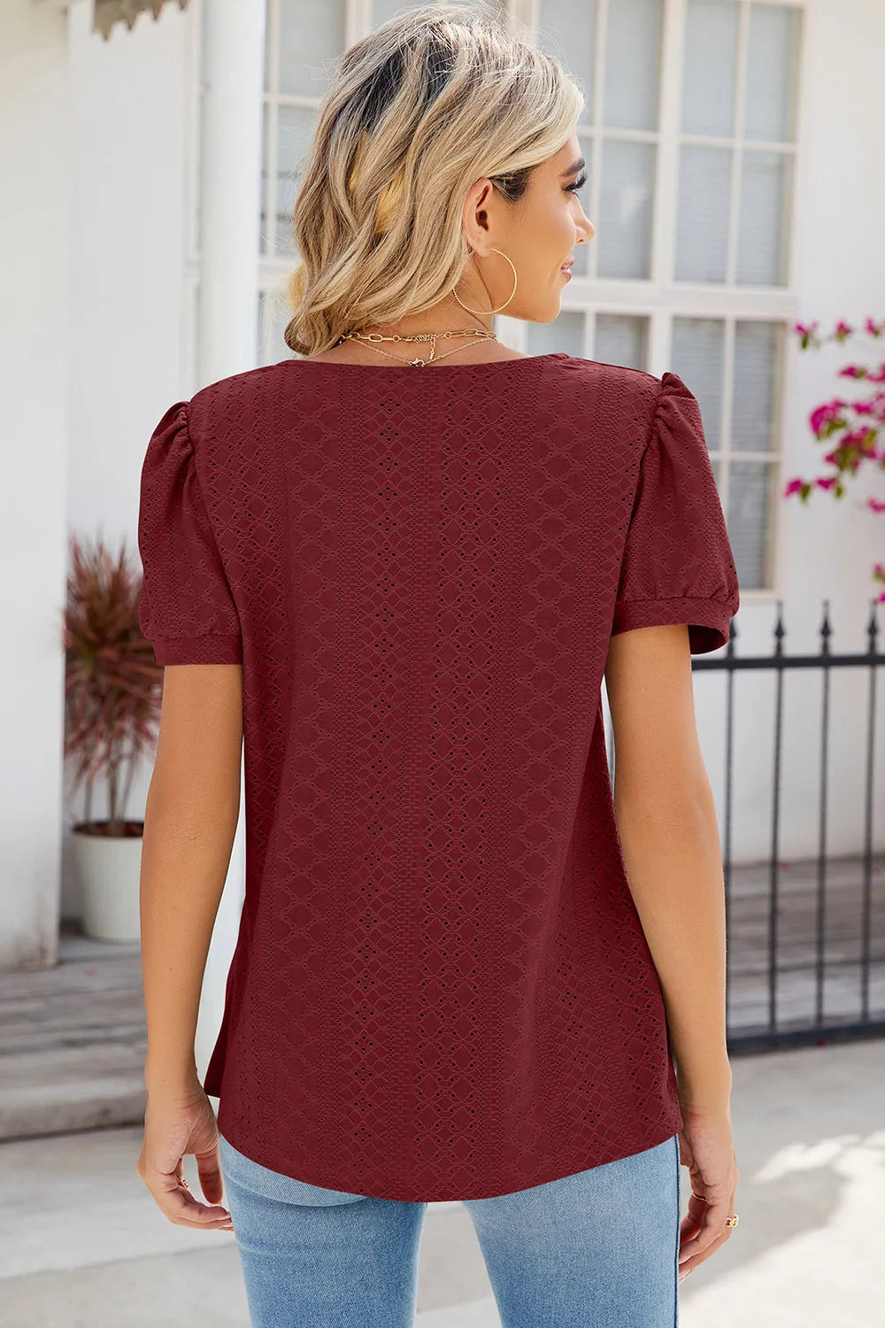 Rust broderie anglaise blouse with decorative eyelet pattern and flattering fit
