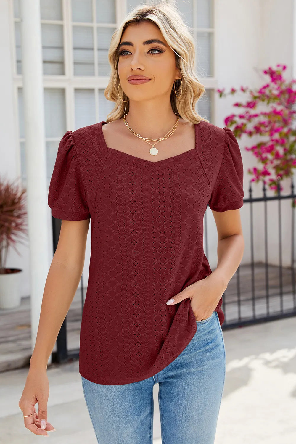 Rust puff sleeve blouse featuring eyelet embroidery and lightweight comfortable fabric
