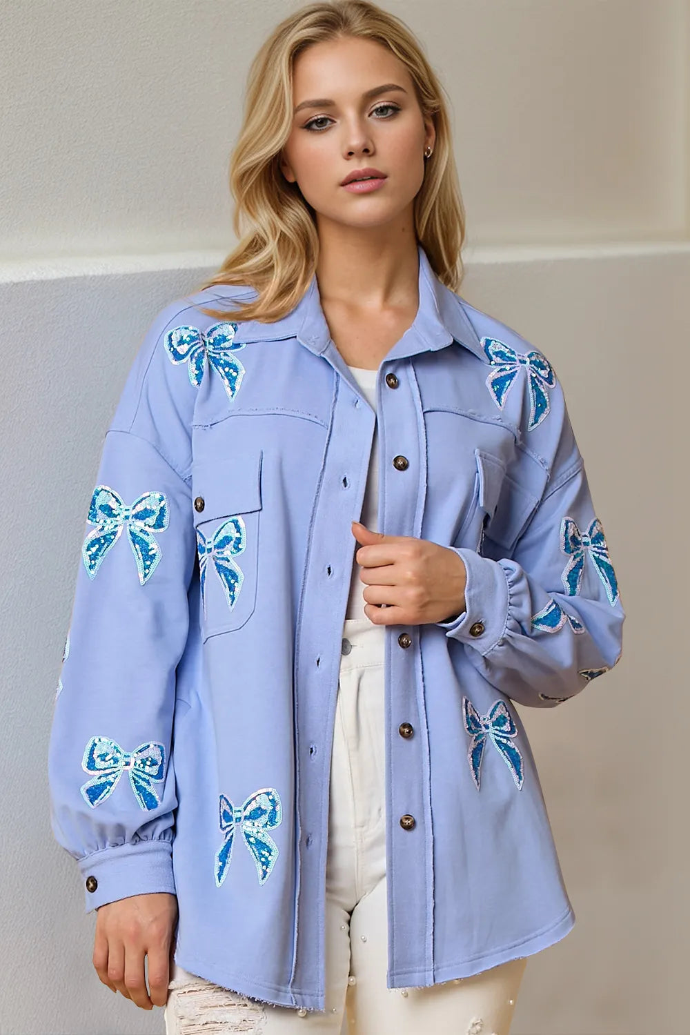 Sequin bow button-up shacket front view plus size women's statement jacket with sparkling embellishments