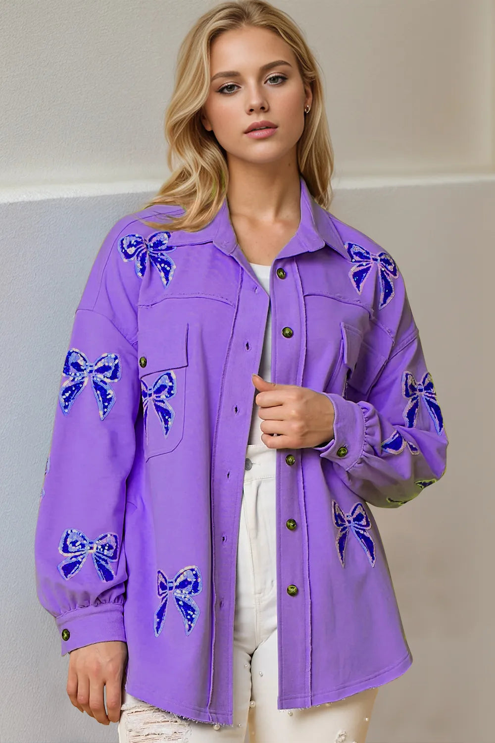 Side profile of sequin bow button-up shacket showcasing relaxed fit and decorative sequin bow details