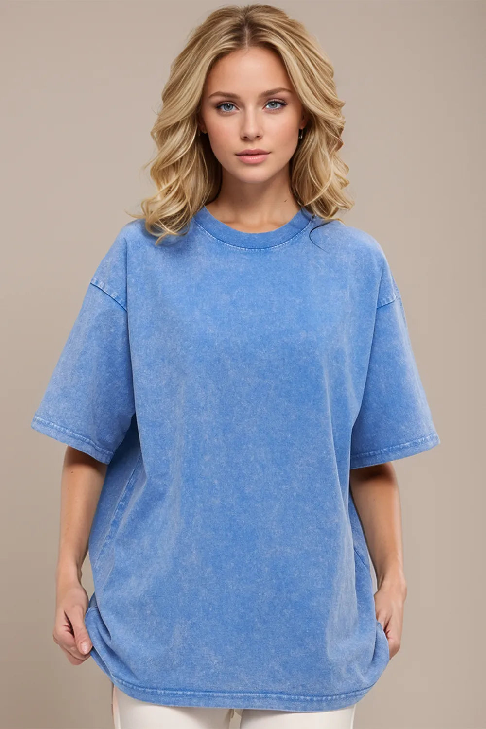 Woman wearing a blue t-shirt against a beige background