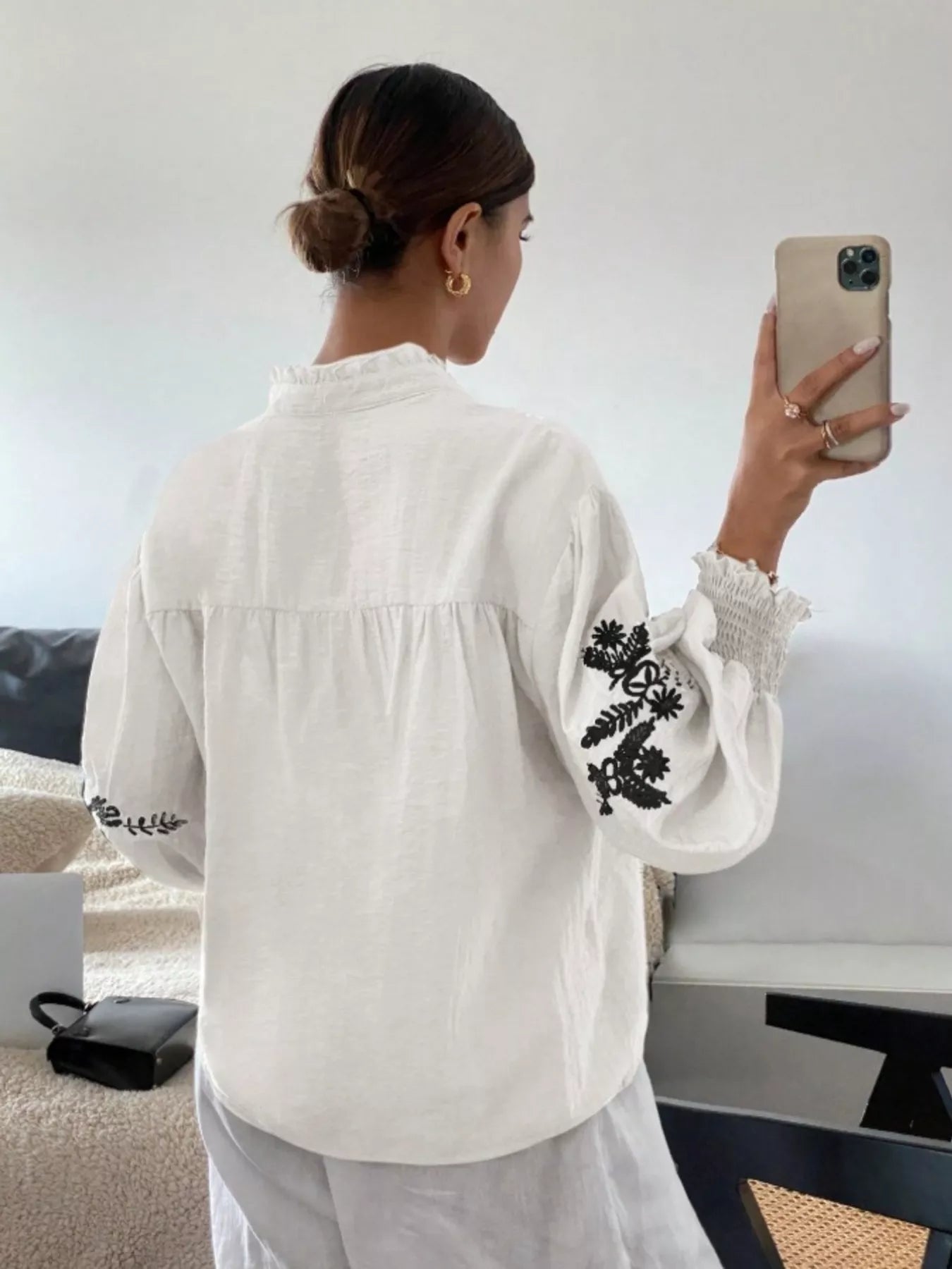 White embroidered long sleeve blouse side profile comfortable and versatile women's clothing