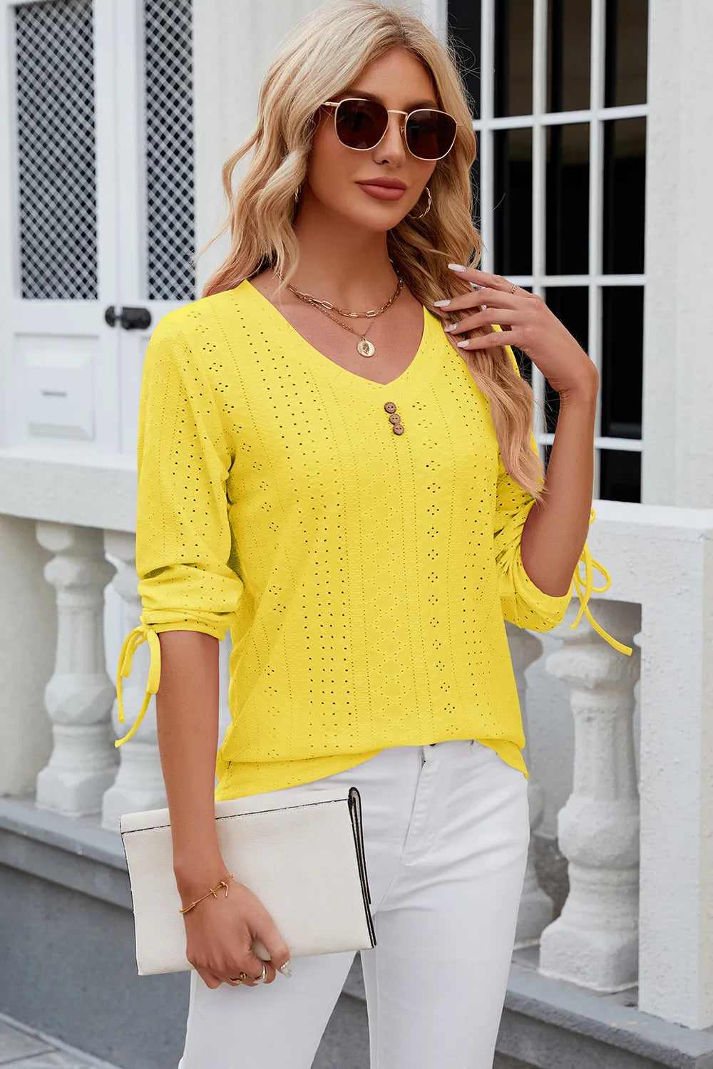 Yellow eyelet drawstring V neck top with half sleeves and cheerful embroidered detailing