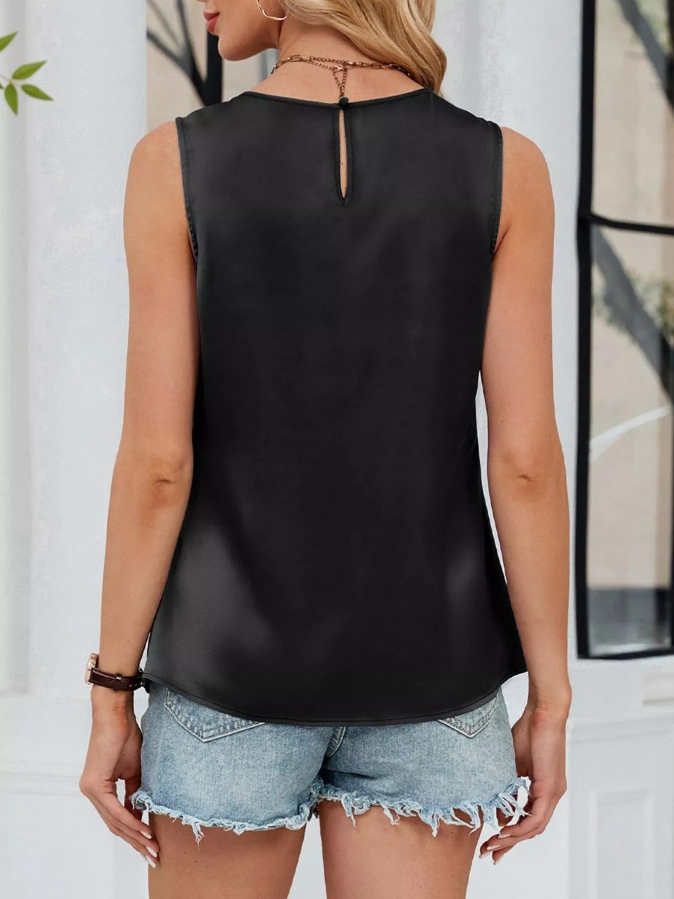 Back view of black sleeveless tank top with flowy silhouette and comfortable fit