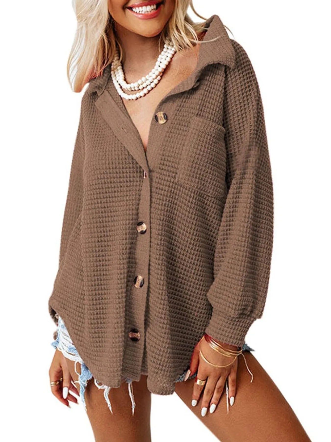 Woman wearing a brown cardigan on a white background