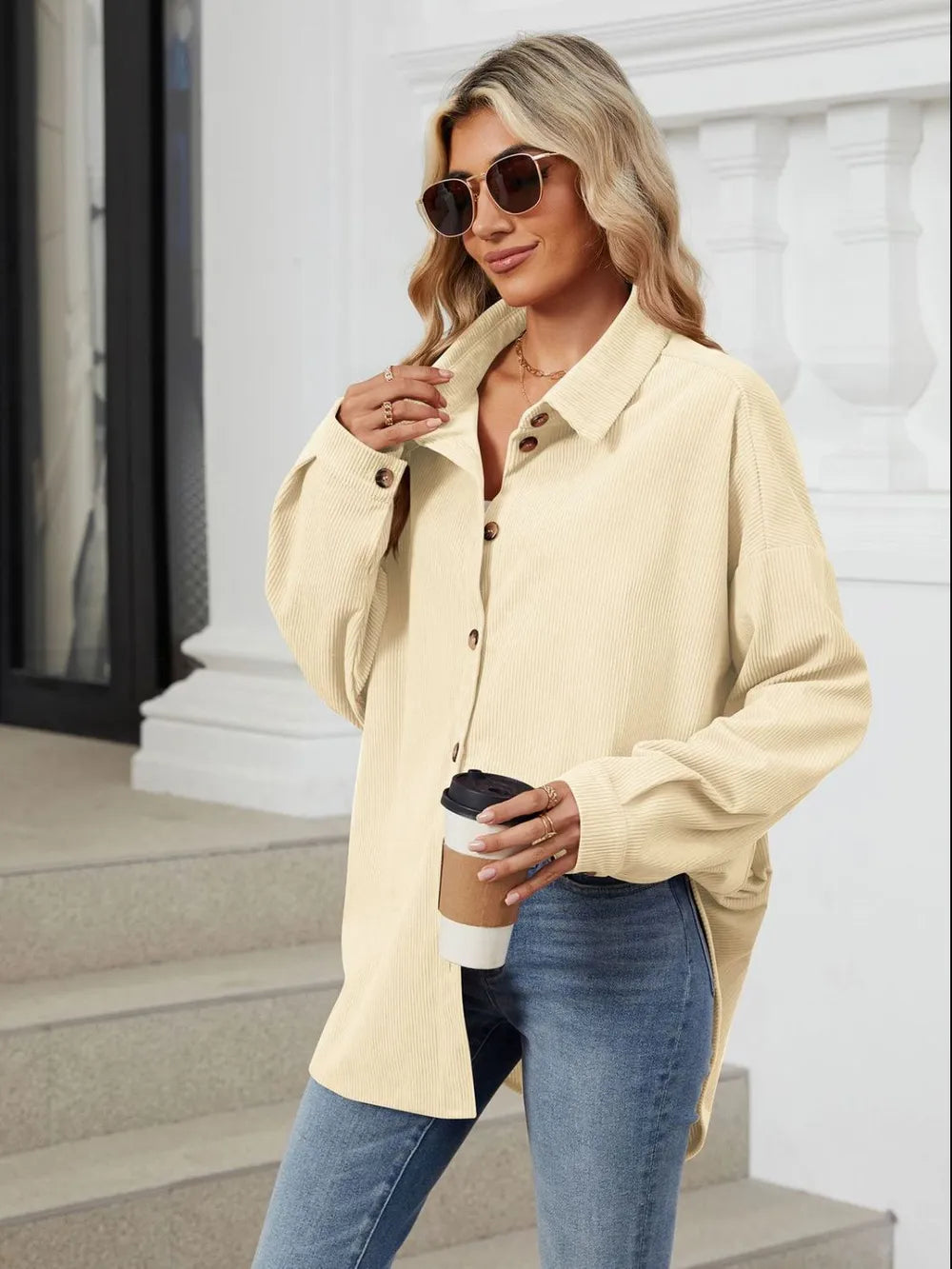Cream collared long sleeve shirt side angle featuring relaxed dropped shoulder fit