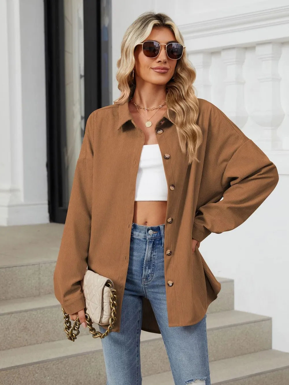 Mustard collared long sleeve shirt worn open over white top with relaxed dropped shoulder design