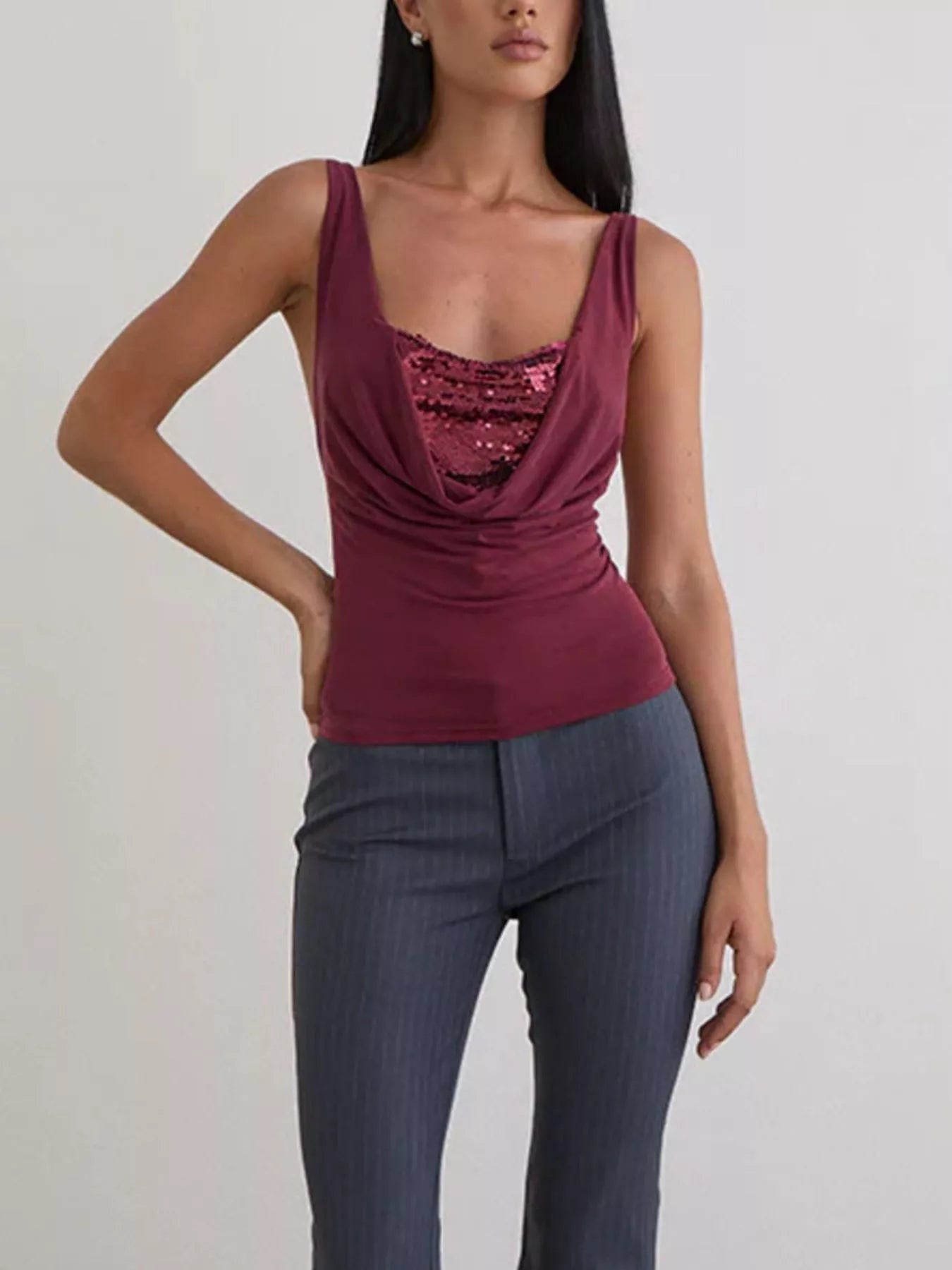 Women's burgundy fitted cami top with a draped cowl neckline and sequin lace panel detail, styled for an elegant evening look
