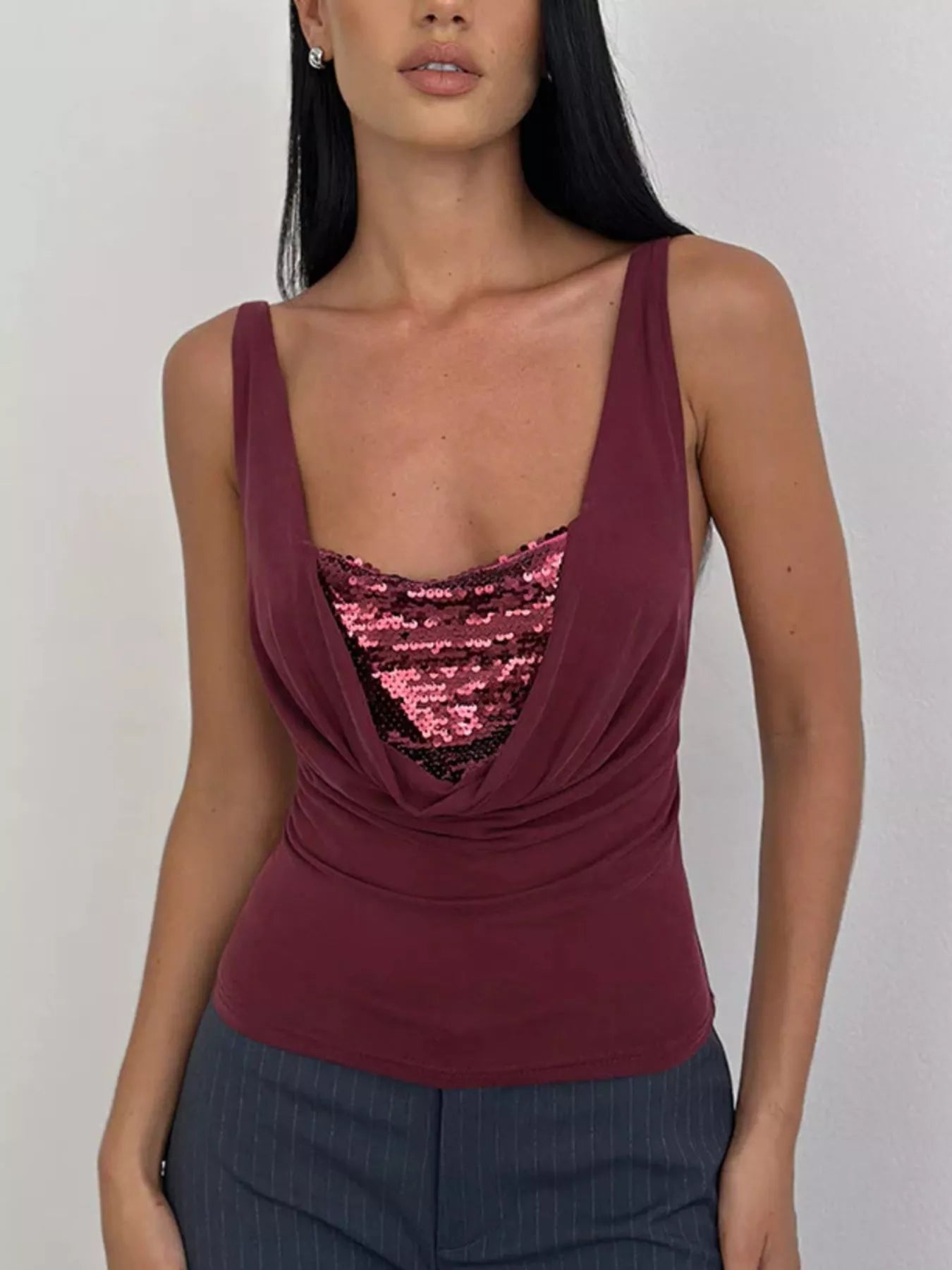 Women's burgundy fitted cami top featuring a draped cowl neckline with lace panel detail, styled with grey trousers in a smart casual look
